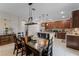 Stylish kitchen with granite countertops, stainless steel appliances, and a dining area at 3172 Jade Tree Pt, Oviedo, FL 32765