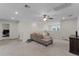 Spacious upstairs living area with neutral carpet, a sectional sofa, and plenty of natural light at 3172 Jade Tree Pt, Oviedo, FL 32765