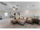 Open living area with a sectional sofa, neutral carpet, plenty of light, and access to other rooms at 3172 Jade Tree Pt, Oviedo, FL 32765