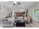 Comfortable living room with a ceiling fan and view of the kitchen at 3172 Jade Tree Pt, Oviedo, FL 32765