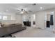 Cozy upstairs living area with neutral carpet, a comfortable sofa, and a view to the bedrooms and bathrooms at 3172 Jade Tree Pt, Oviedo, FL 32765