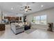 Spacious living room featuring tile floors, a ceiling fan, and a comfortable sofa at 3172 Jade Tree Pt, Oviedo, FL 32765