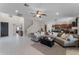 Open-concept living room with tile flooring and seamless flow into the kitchen at 3172 Jade Tree Pt, Oviedo, FL 32765