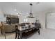 Open-concept living space with dining area, kitchen, and comfortable seating at 3172 Jade Tree Pt, Oviedo, FL 32765