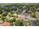Aerial view of the property and its neighborhood, with tree coverage and residential streets at 325 Little Aspen Ct, Ocoee, FL 34761