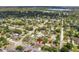 Aerial shot showcasing the property's location with a lake view and lush, green surroundings at 325 Little Aspen Ct, Ocoee, FL 34761