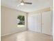 Bedroom with tile flooring and a window that looks out to the backyard and play set at 325 Little Aspen Ct, Ocoee, FL 34761