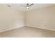 Simple bedroom featuring neutral walls, tile flooring, and a ceiling fan at 325 Little Aspen Ct, Ocoee, FL 34761