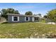 Single-story home with a gray exterior and white trim, plus a well-maintained front yard and fence at 325 Little Aspen Ct, Ocoee, FL 34761
