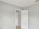Clean and bright hallway showcasing neutral walls, white doors and tile flooring at 325 Little Aspen Ct, Ocoee, FL 34761