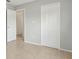 Hallway features neutral walls, tile flooring, two white doors and double door closet at 325 Little Aspen Ct, Ocoee, FL 34761