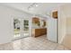 Bright kitchen with oak cabinets, white appliances, and backyard view through glass doors at 325 Little Aspen Ct, Ocoee, FL 34761