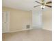 Spacious living room with tile flooring, ceiling fan, and access to other rooms at 325 Little Aspen Ct, Ocoee, FL 34761