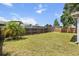 Spacious backyard features a well-maintained lawn and privacy fence, perfect for outdoor activities at 399 Lake Daisy Dr, Winter Haven, FL 33884