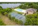 Aerial view of community with pool, tennis courts and lake views at 4312 Lake Underhill Rd # 19-B, Orlando, FL 32803