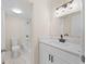 Modern bathroom with a white vanity, sleek fixtures, and a tub-shower combination with white marble style tiles at 4312 Lake Underhill Rd # 19-B, Orlando, FL 32803