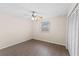 Bedroom featuring a ceiling fan, a window with natural light, wood floors and a closet at 4312 Lake Underhill Rd # 19-B, Orlando, FL 32803