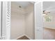 Walk-in closet with built-in shelving and a view of a bedroom at 4312 Lake Underhill Rd # 19-B, Orlando, FL 32803