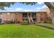 Exterior building with green lawn and stairway at 4312 Lake Underhill Rd # 19-B, Orlando, FL 32803