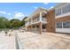 This brick building has a covered walkway and an outside staircase leading to the upper units at 4312 Lake Underhill Rd # 19-B, Orlando, FL 32803