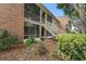 Exterior of building with lush landscaping and beautiful plants at 4312 Lake Underhill Rd # 19-B, Orlando, FL 32803
