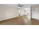 Large living room with wood floors, a front door and a view of the kitchen at 4312 Lake Underhill Rd # 19-B, Orlando, FL 32803