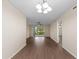 Spacious living room with wood floors, neutral walls, sliding glass doors to outdoor patio and a ceiling fan at 4312 Lake Underhill Rd # 19-B, Orlando, FL 32803