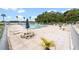 Community pool with lounge chairs and picnic seating at 4312 Lake Underhill Rd # 19-B, Orlando, FL 32803