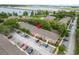 Aerial view of community with mature trees, ample parking, and lush lawns, enhancing its appeal at 4312 Lake Underhill Rd # 19-B, Orlando, FL 32803