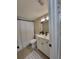 Bathroom featuring white vanity, black hardware, neutral walls, a toilet, and shower with white curtain at 4883 Cherokee Rose Dr, Orlando, FL 32808