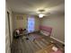 An empty bedroom featuring a ceiling fan, and laminate flooring at 51 Fir Dr, Ocala, FL 34472