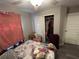 View of a bedroom with an open closet and sliding doors, laminate flooring, ceiling fan at 51 Fir Dr, Ocala, FL 34472