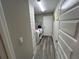 Functional laundry room with washer, dryer hookups, modern flooring, and convenient access to other rooms at 51 Fir Dr, Ocala, FL 34472