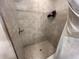Modern shower stall features neutral tile surround, sleek fixtures, and convenient in-shower storage at 51 Fir Dr, Ocala, FL 34472