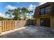 This home has a cozy, private backyard with a wooden fence and stone features at 5287 Cypress Ct # 724, Orlando, FL 32811