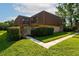 Charming exterior of the townhouse with a courtyard, fenced yard and green lawn at 5287 Cypress Ct # 724, Orlando, FL 32811