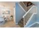 Foyer view featuring stairs to the second floor and dining area with a chandelier at 5287 Cypress Ct # 724, Orlando, FL 32811