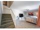 Bright living room with tile floors, stairs, and comfortable seating at 5287 Cypress Ct # 724, Orlando, FL 32811