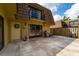 Wide patio with a grill, sliding glass doors, and a welcoming front door with a wreath at 5287 Cypress Ct # 724, Orlando, FL 32811
