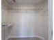 Walk-in closet with white wire shelving for optimal storage at 6569 Long Breeze N Rd, Orlando, FL 32810