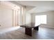 Open dining room featuring hardwood floors, a view of the foyer, and bright natural light at 6569 Long Breeze N Rd, Orlando, FL 32810