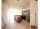 Spacious kitchen with a center island, stainless steel appliances, and tile flooring at 6569 Long Breeze N Rd, Orlando, FL 32810