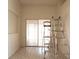 Living room with sliding doors to outdoor area and tile floor at 6569 Long Breeze N Rd, Orlando, FL 32810