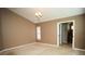 Empty bedroom with neutral carpet, light-colored walls and trim, and traditional chandelier at 687 N Endeavour Dr, Winter Springs, FL 32708