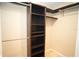 Closet with dark wood built in shelves and hanging racks at 687 N Endeavour Dr, Winter Springs, FL 32708