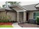 Charming single-Gathering home with brick exterior, mature trees, and a well-maintained lawn at 687 N Endeavour Dr, Winter Springs, FL 32708