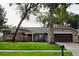 Charming single-Gathering home with brick exterior, mature trees, and a well-maintained lawn at 687 N Endeavour Dr, Winter Springs, FL 32708