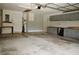 The garage includes built in cabinets, a water heater, utility sink, and access door at 687 N Endeavour Dr, Winter Springs, FL 32708