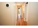Hallway featuring wood floors, neutral paint and doors to various rooms at 687 N Endeavour Dr, Winter Springs, FL 32708
