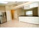 Spacious kitchen features a breakfast bar, stainless steel fridge, and tiled floors at 687 N Endeavour Dr, Winter Springs, FL 32708